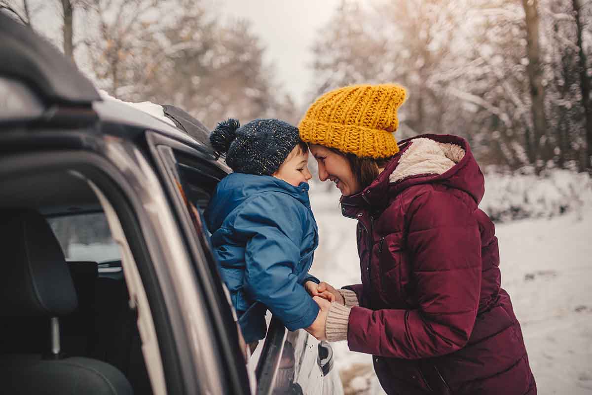 Mother and son on a winter road trip